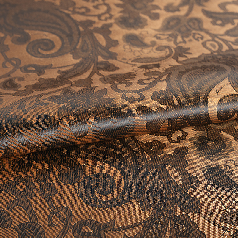 Jacquard med flettet lutblomst i polyester