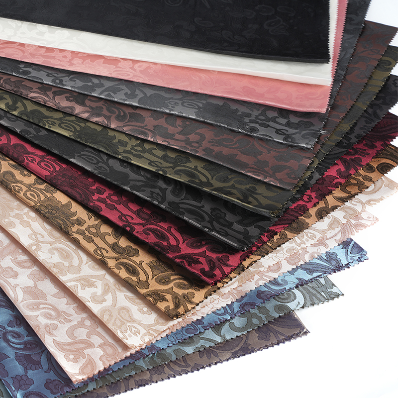 Jacquard med flettet lutblomst i polyester